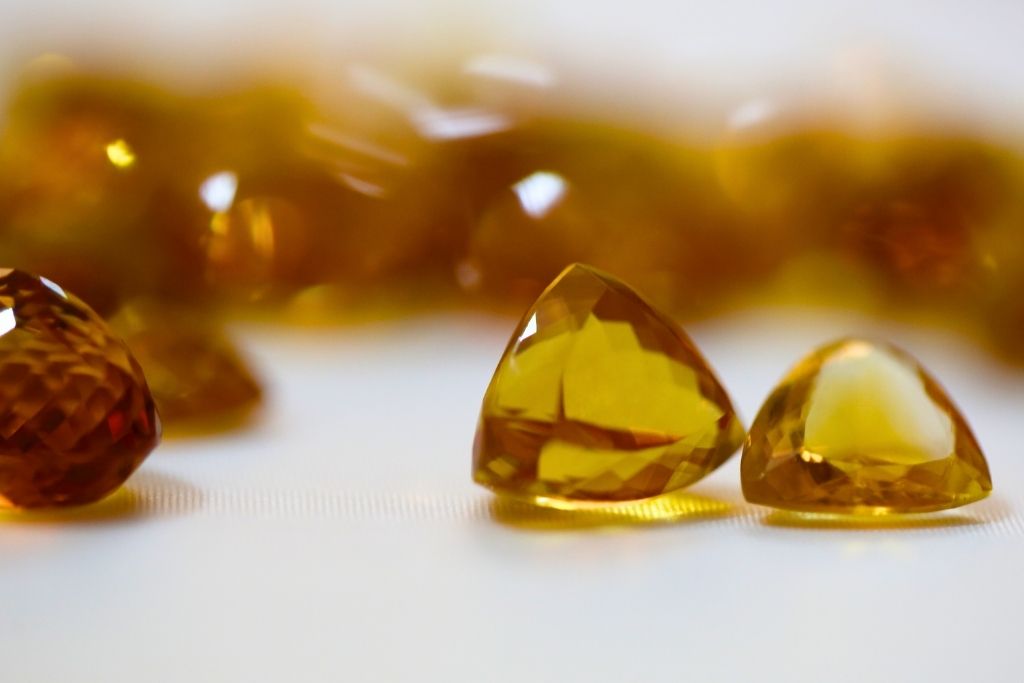 Citrine crystal small chunks scattered on table