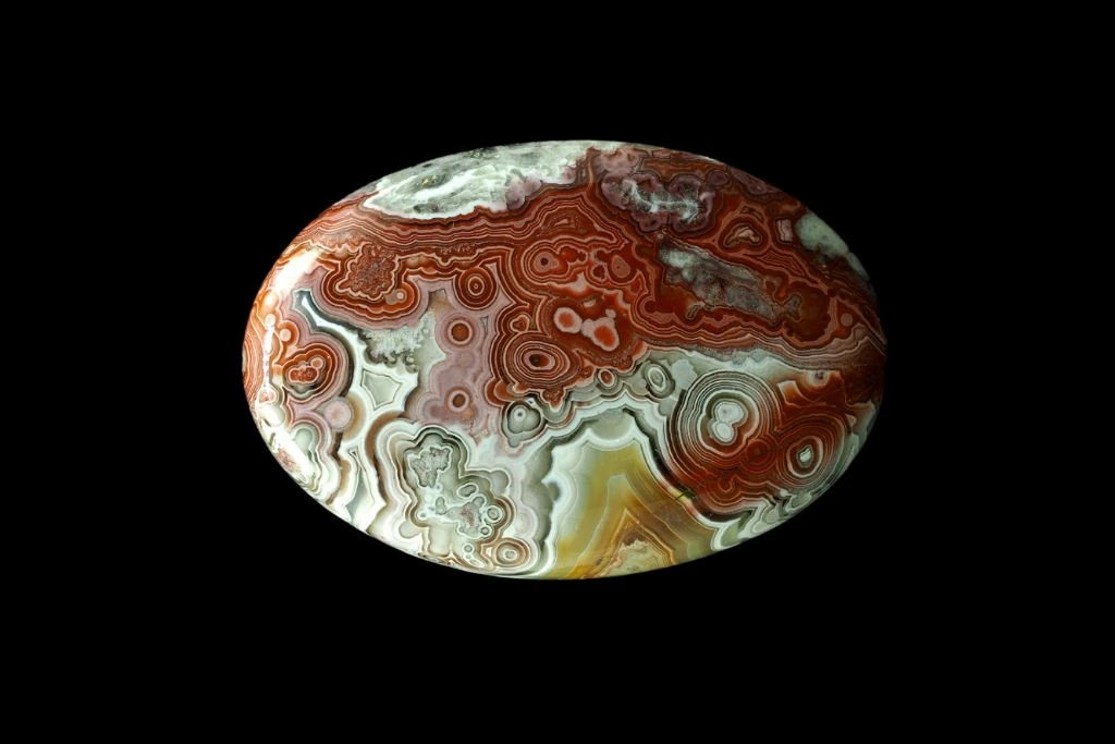 A crazy lace agate on a black background