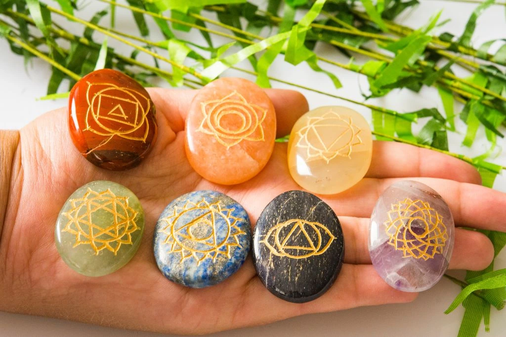 Different kinds of crystals that has a chakra sign embedded on it