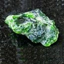 Diopside crystal on a graphite tile