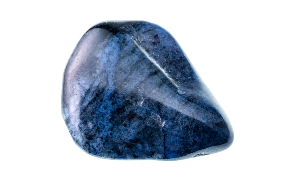 A polished Dumortierite crystal on a white background