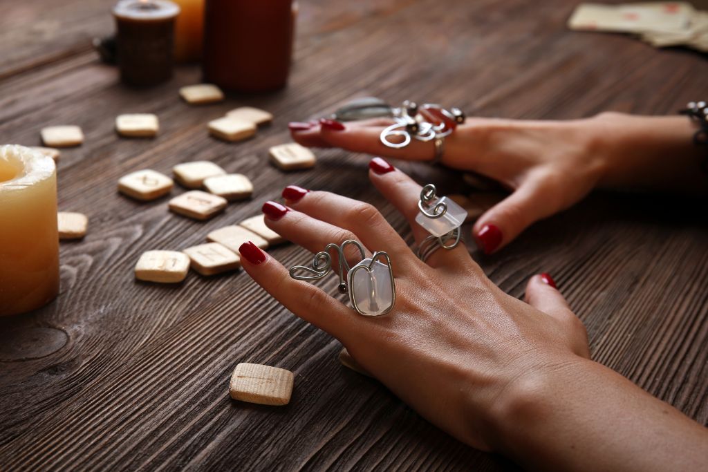 Fortune teller telling fortune with crystal rings 