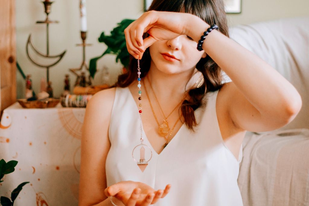 woman doing gazing practice to her crystals