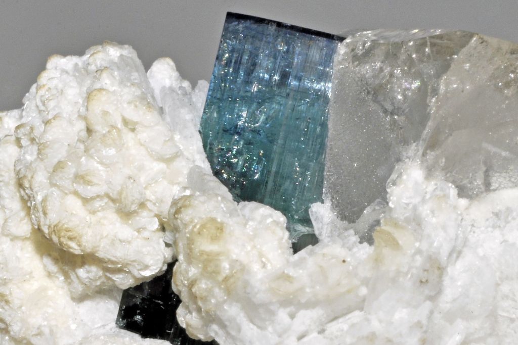 Indicolite gemstone attached to quartz and albite. Image Source: flickr.com | Géry Parent