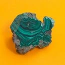 Malachite on a yellow background