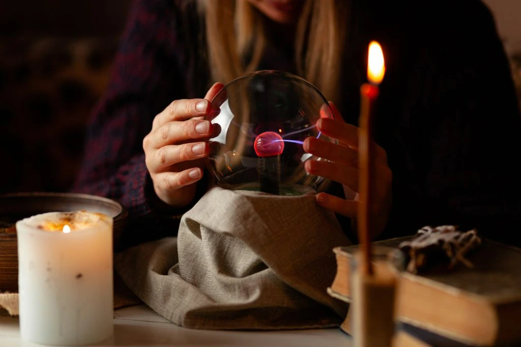 Seer with magic ball performing a ritual for psychic vision and future telling