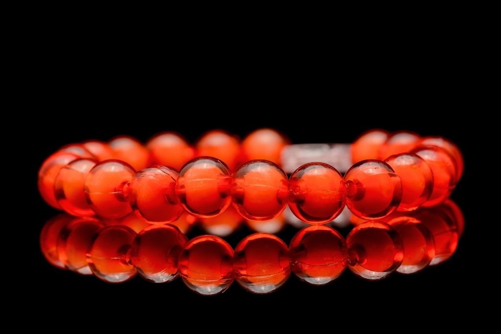 Red coral bracelet on a black background