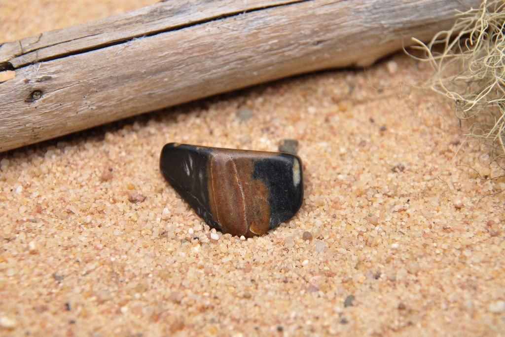 a sardonyx crystal on the sand