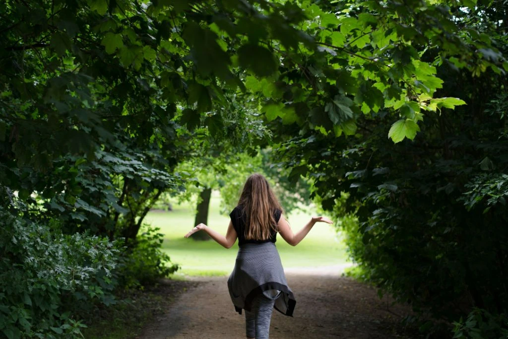 Woman walking in nature in harmony