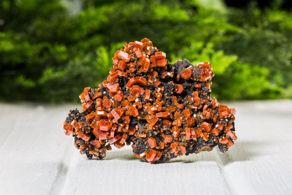 A raw vanadinite crystal on the table