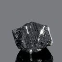 black tourmaline on grayish backgorund