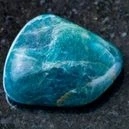 blue apatite on a black granite