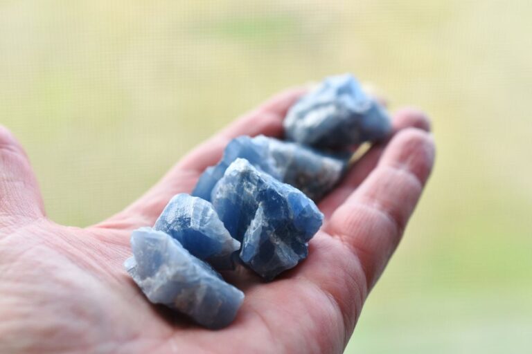 Blue calcite crystals on the palm