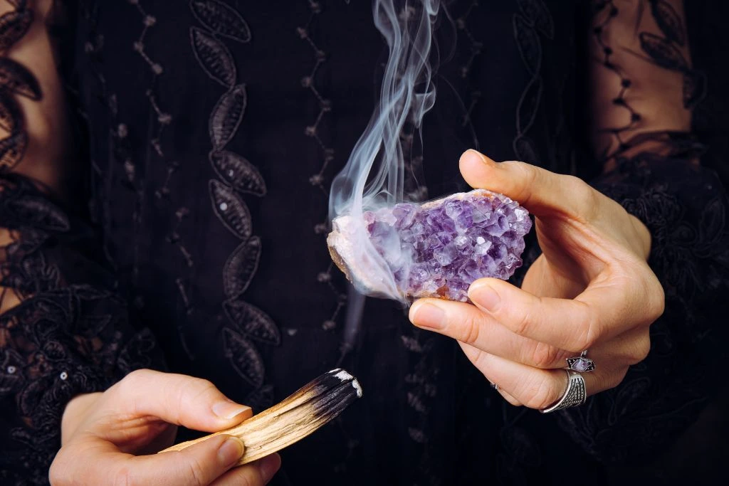 Amethyst crystal cleansing using incense smoke