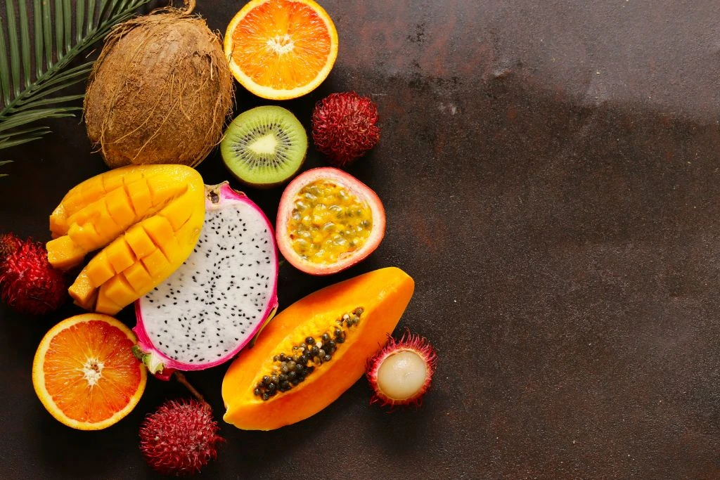 Different kinds of fruit on a concrete surface