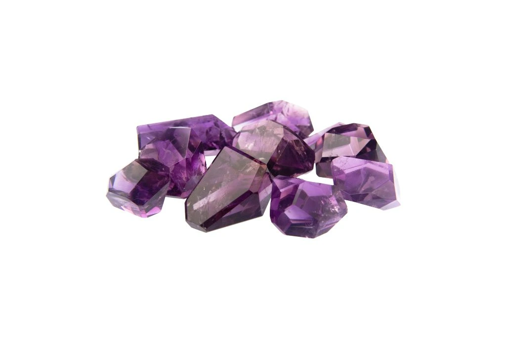 freeform amethyst crystals on a white background
