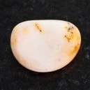 a polished picture jasper on a black granite