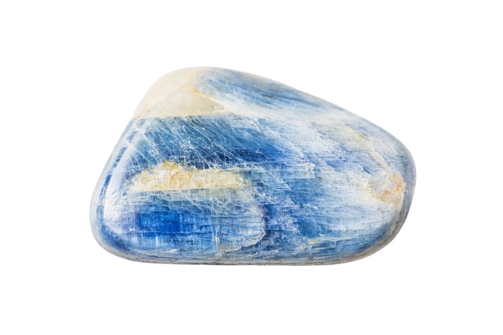 Polished blue kyanite crystal on a white background