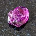 rhodolite crystal on a graphite tile