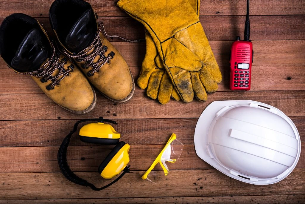 different kinds of safety equipment on the wooden table