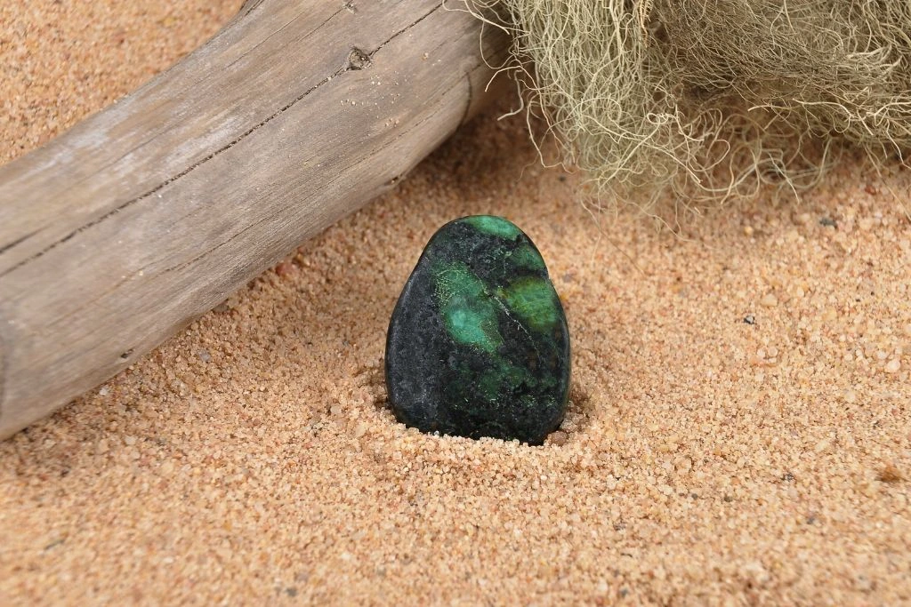 A zoisite crystal on the sand