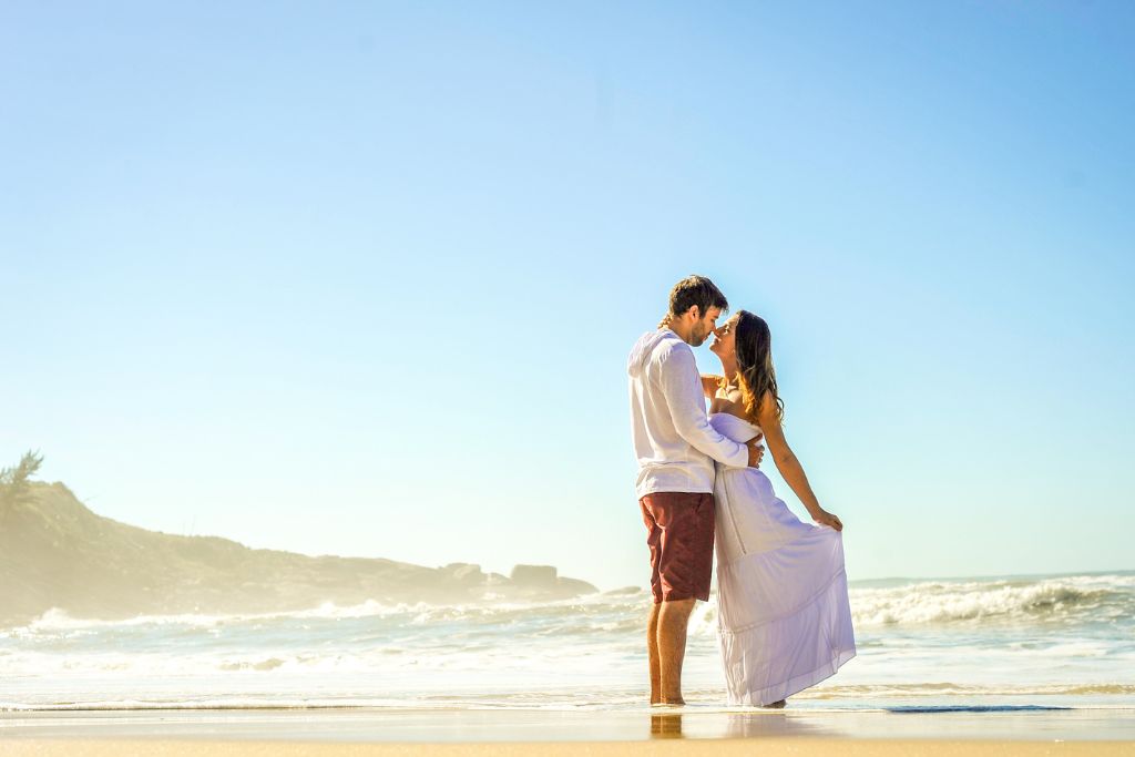 A couple standing on the beach