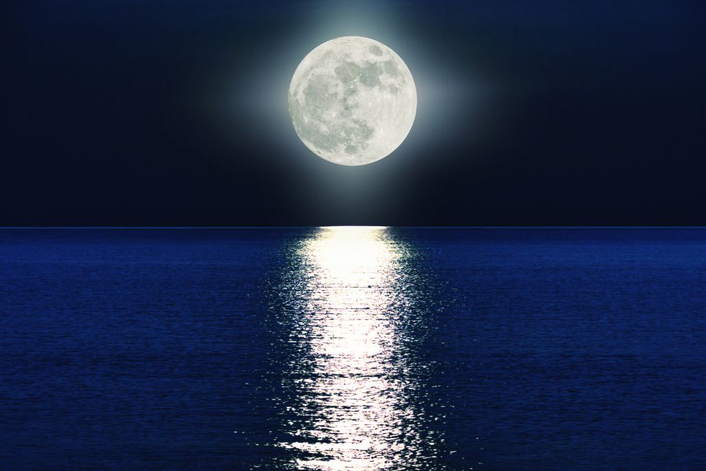 A full moon over the sea