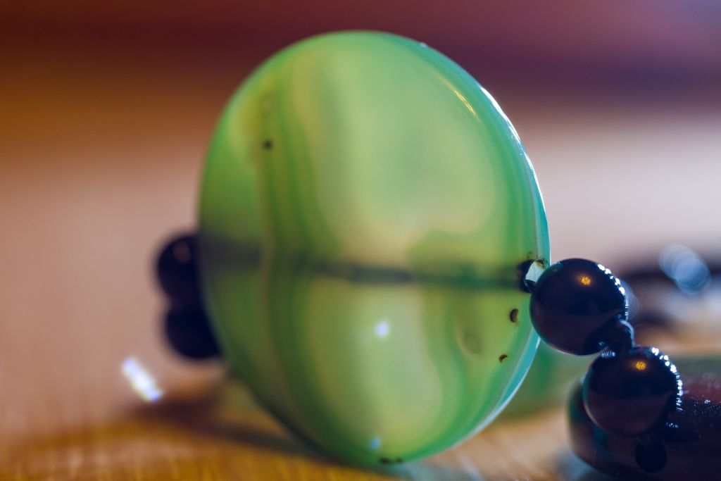 A green agate bracelet on a table