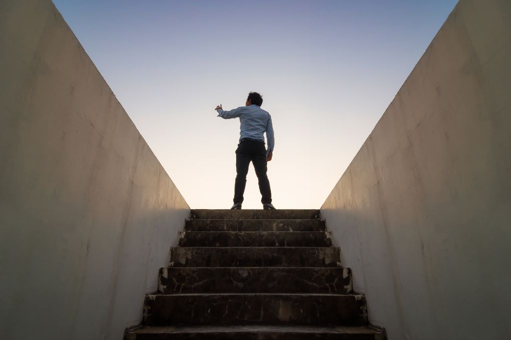 A man reached the top of the stairs