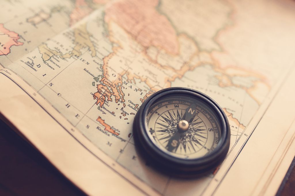 A map and compass on the table