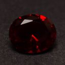 a red diamond on a dark background