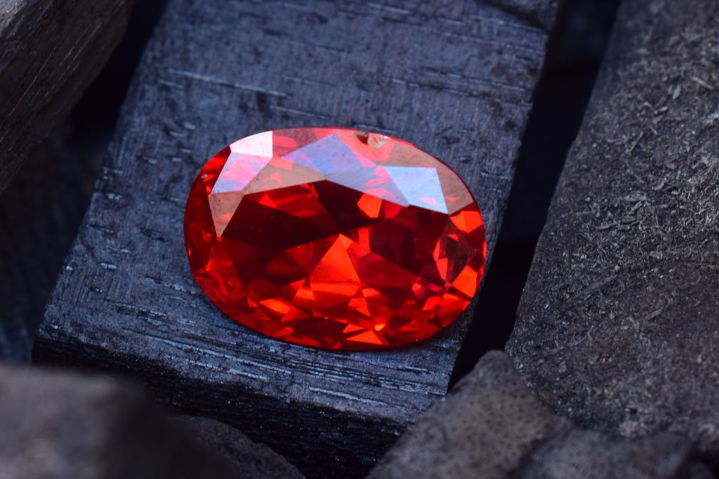 A ruby on a burned wood