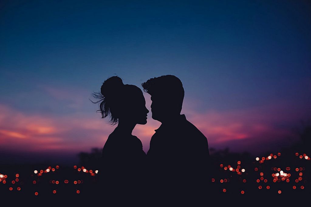 A silhouette of a man and a woman