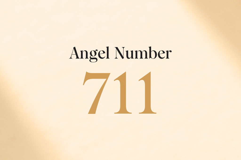 angel number 711 on beige background