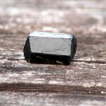 Black Tourmaline on a wooden bakcground