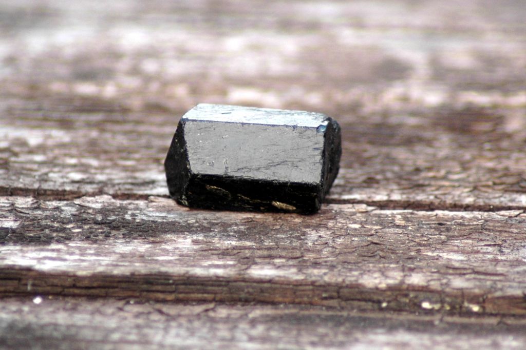 Black Tourmaline on a wooden background