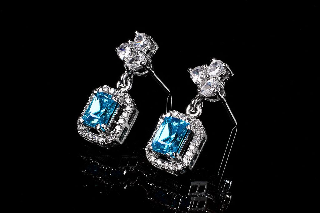 Blue Topaz earrings on a black background