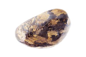 A bronzite crystal on a white background