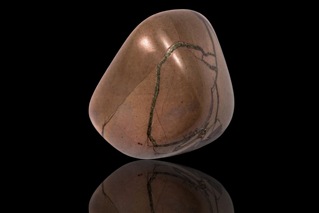 Brown Jasper on a black reflective background