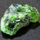 Chrome Diopside crystal on a black granite