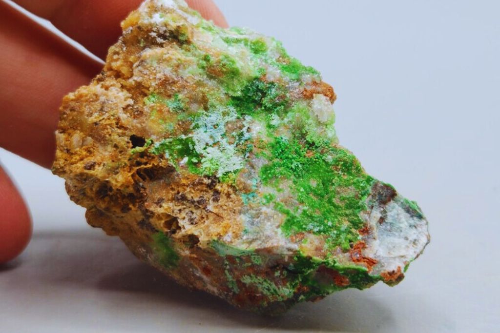 a person holding a Conichalcite mineral. Image source: Etsy | Dereck HealingCrystalShopCA
