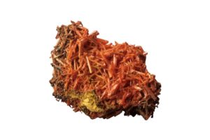 A raw crocoite crystal on a white background