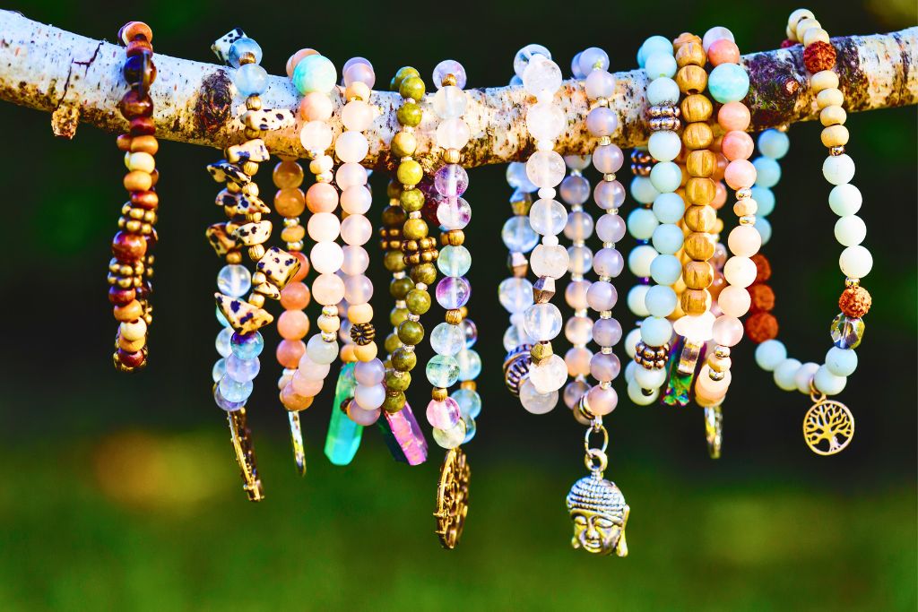 collection of crystals hanging on a wood stem