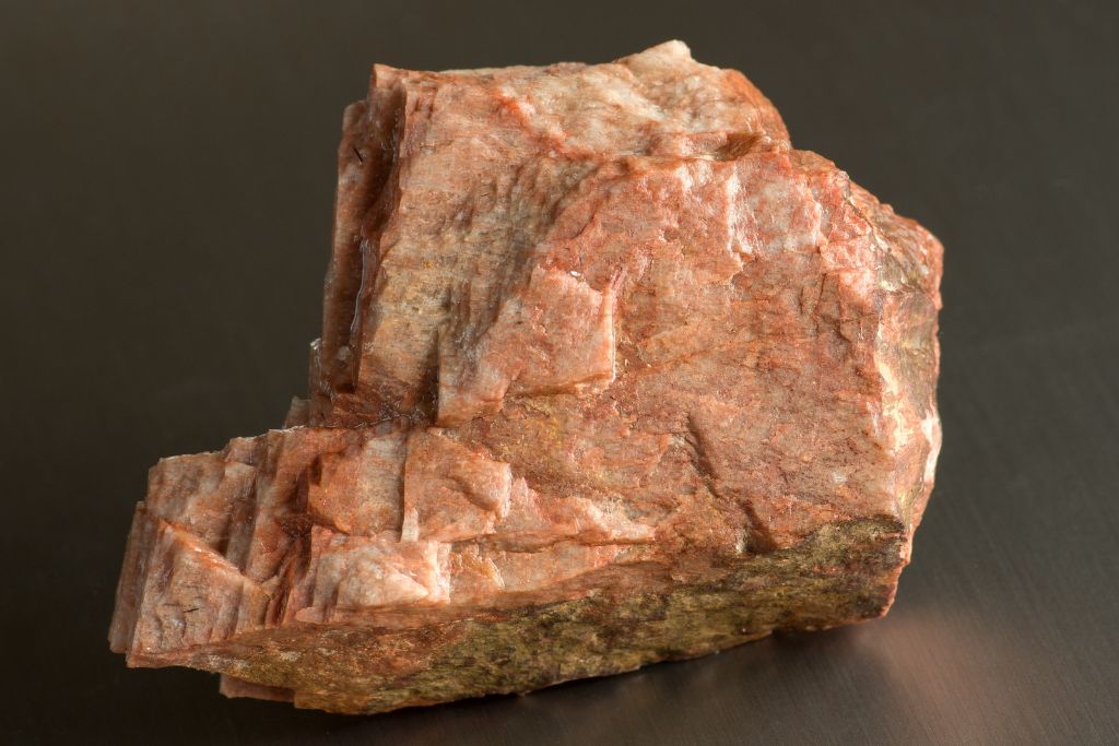 A raw feldspar crystal on a table