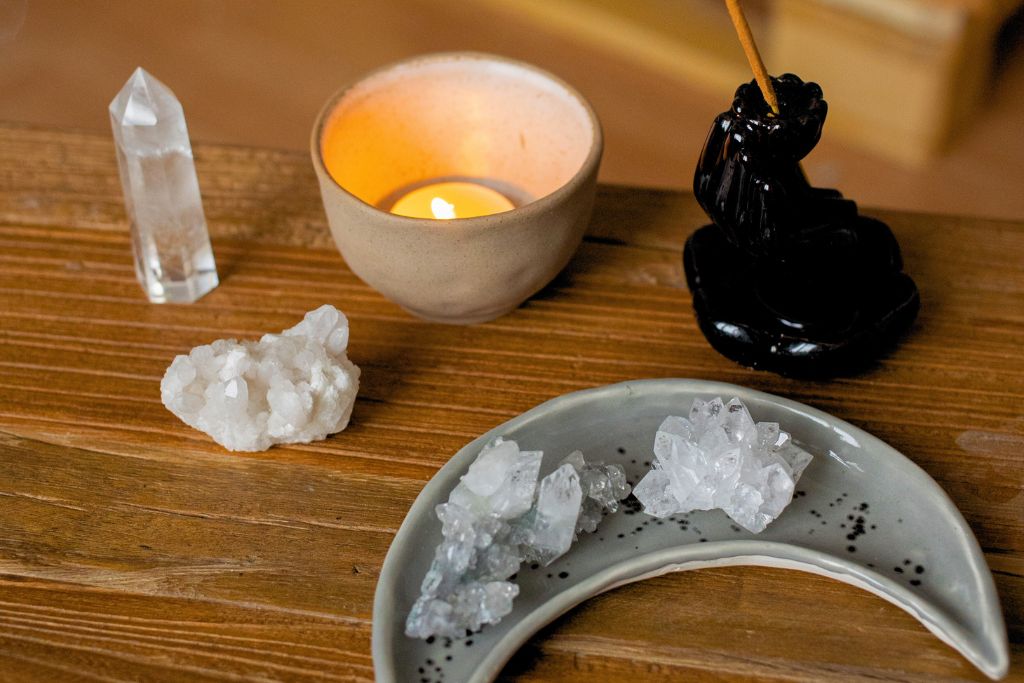 Crystals, burning candles, and incense sticks were used in the cleansing method