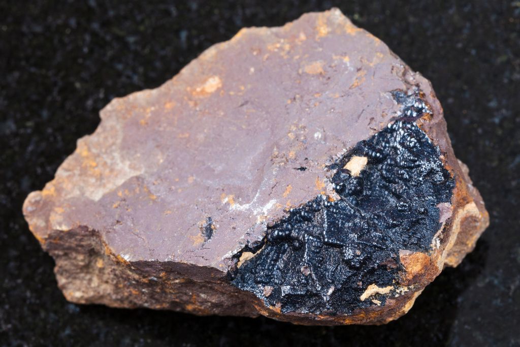 A cut of Goethite crystal on a black granite