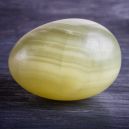 Green onyx egg on dark background