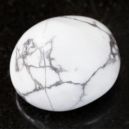 Howlite gem on a graphite tile