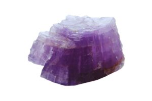 A raw lepidolite crystal on a white background