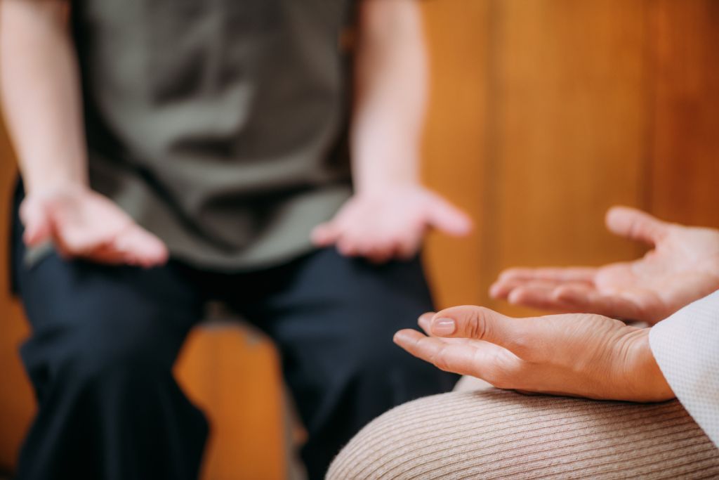 Two person meditating while sitting.